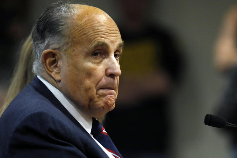 Rudy Giuliani, personal lawyer of President Donald Trump, looks on during an appearance before the Michigan House Oversight Committee in Lansing, Michigan on December 2, 2020.