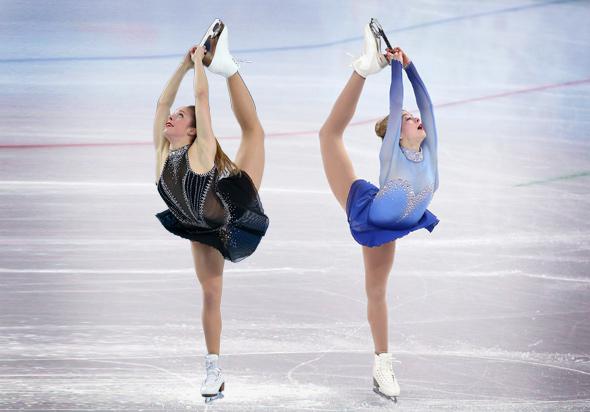 Left, Ashley Wagner of the United States competes in the Figure Skating Team Ladies Short Program; Gracie Gold of the United States competes in the Team Ladies Free Skating in Sochi, Russia, February 2014.