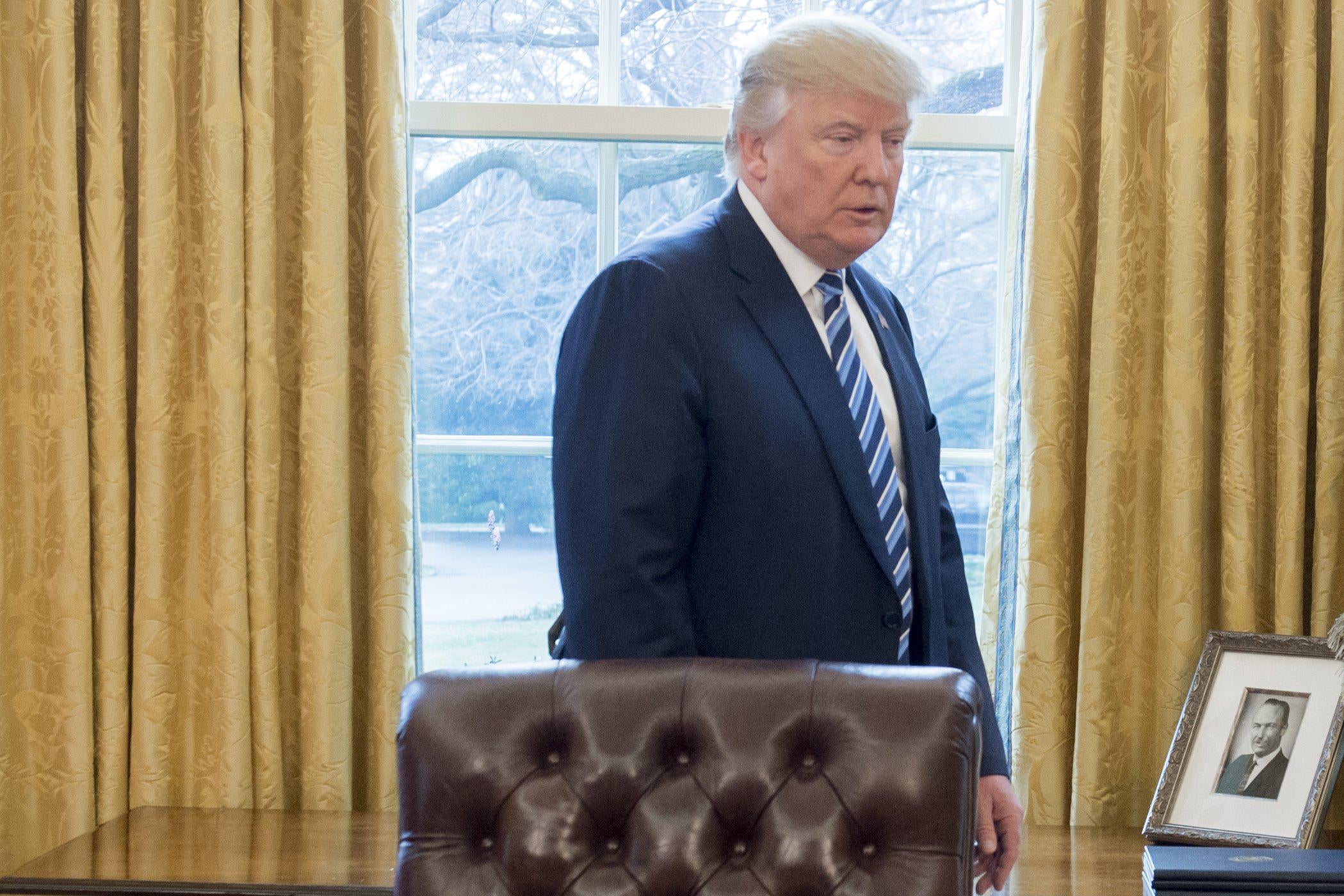 A photograph of Fred Trump, the father of US President Donald Trump, is seen in the Oval Office of the White House on February 9, 2017. 