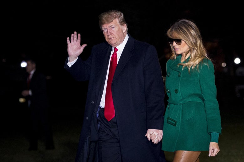 President Donald Trump and First Lady Melania Trump make their way across the South Lawn of the White House after returning on Marine One from their surprise trip to Al Asad Air Base in Iraq to visit troops, on December 27, 2018 in Washington, D.C. 