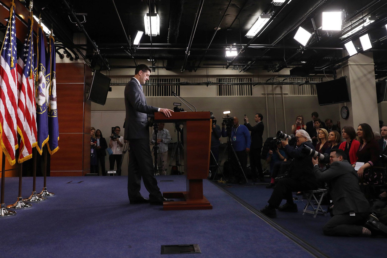 Paul Ryan stands behind a podium.