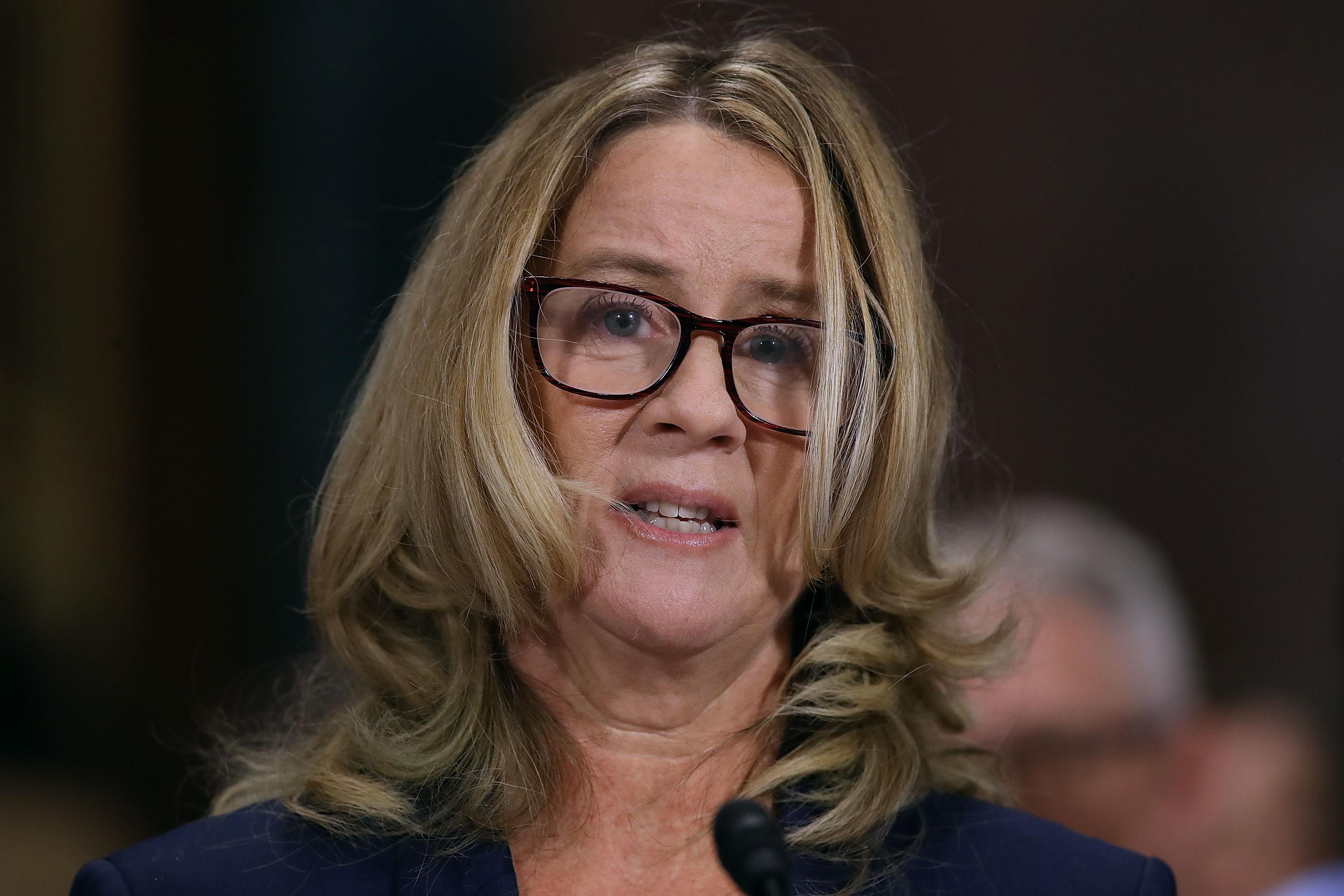 Christine Blasey Ford appears emotional as she speaks before the committee