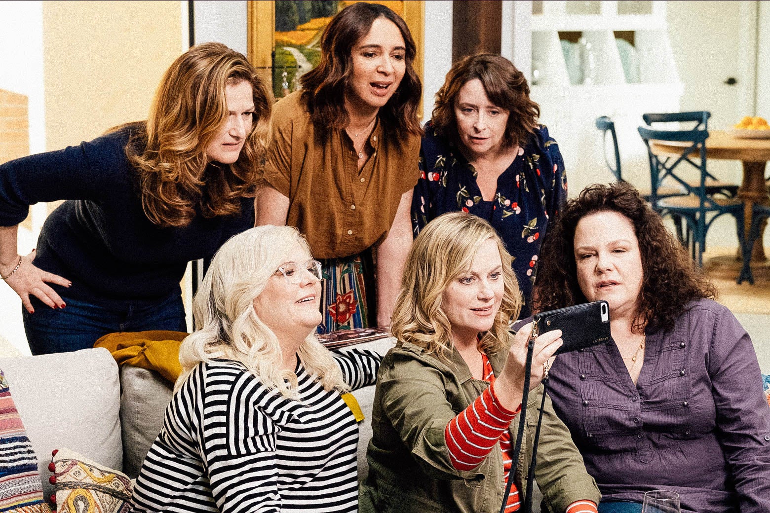 From top left: Ana Gasteyer, Maya Rudolph, Rachel Dratch, Paula Pell, Amy Poehler, and Emily Spivey mug for a selfie in this still from Wine Country.