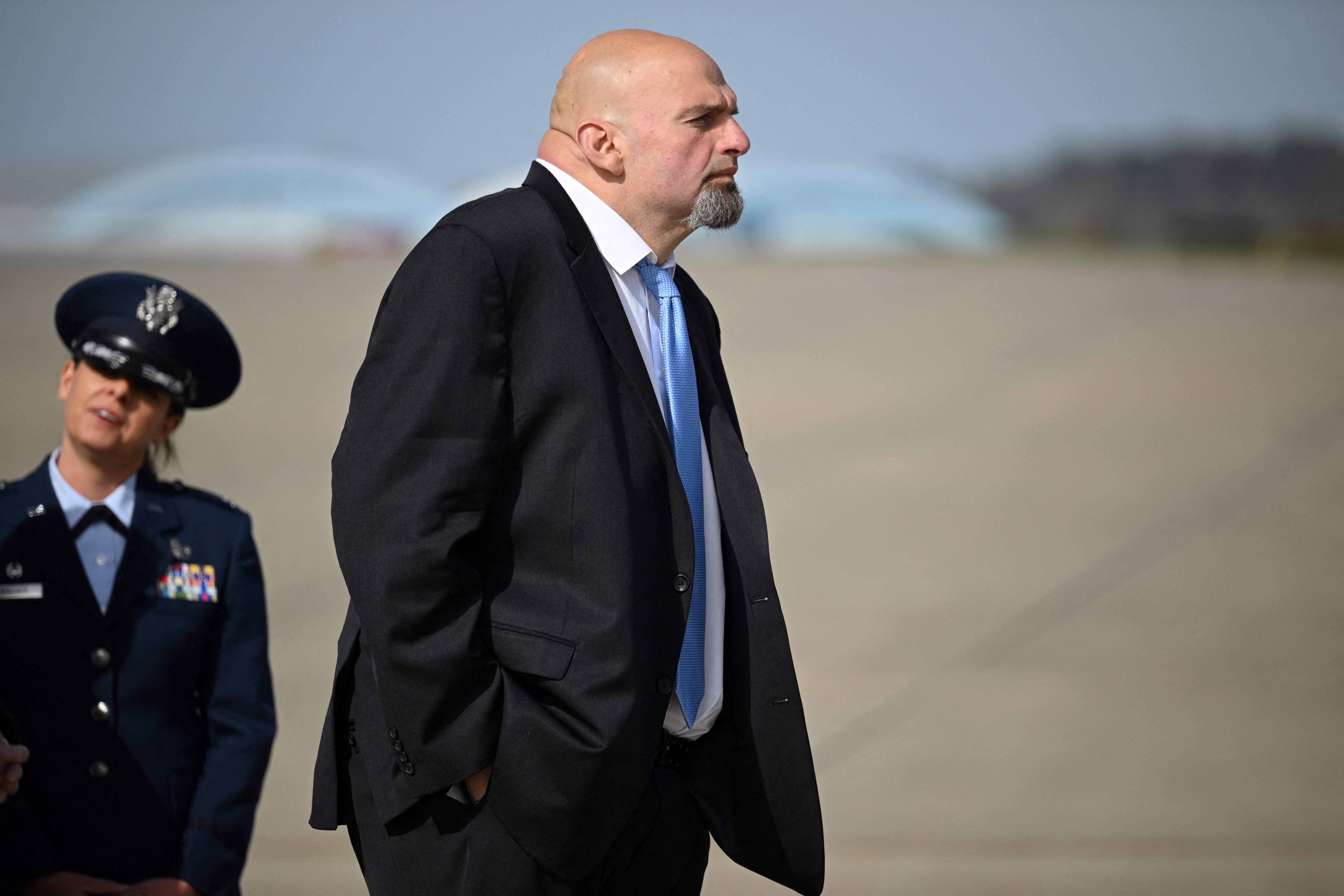 Pennsylvania Lt. Gov. and Democratic senatorial candidate John Fetterman waits for US President Joe Biden to step off Air Force One at Pittsburgh International Airport in Pittsburgh, Pennsylvania, on October 20, 2022. (Photo by MANDEL NGAN / AFP) (Photo by MANDEL NGAN/AFP via Getty Images)