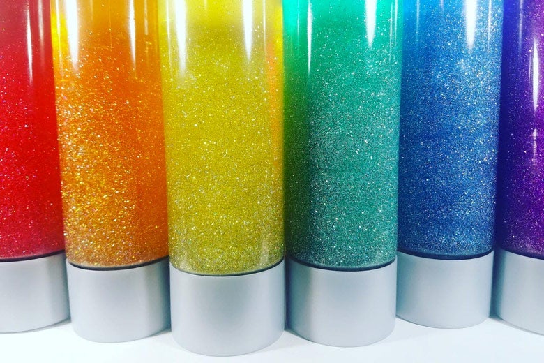 Bottles filled with glitter of different colors.