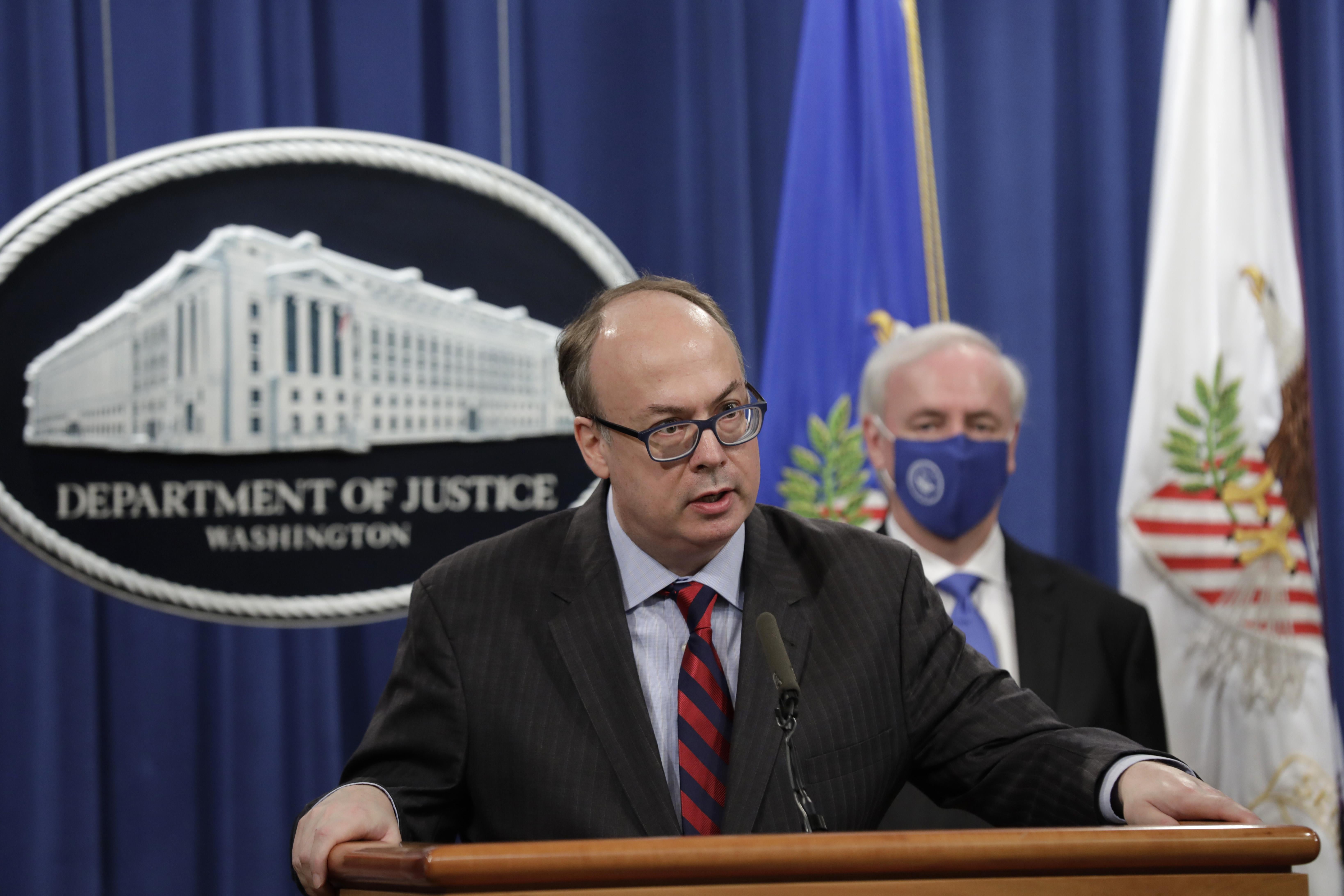Acting Assistant US Attorney General Jeffrey Clark speaks next to Deputy US Attorney General Jeffrey Rosen at a news conference at the Justice Department in Washington, D.C. on October 21, 2020. 