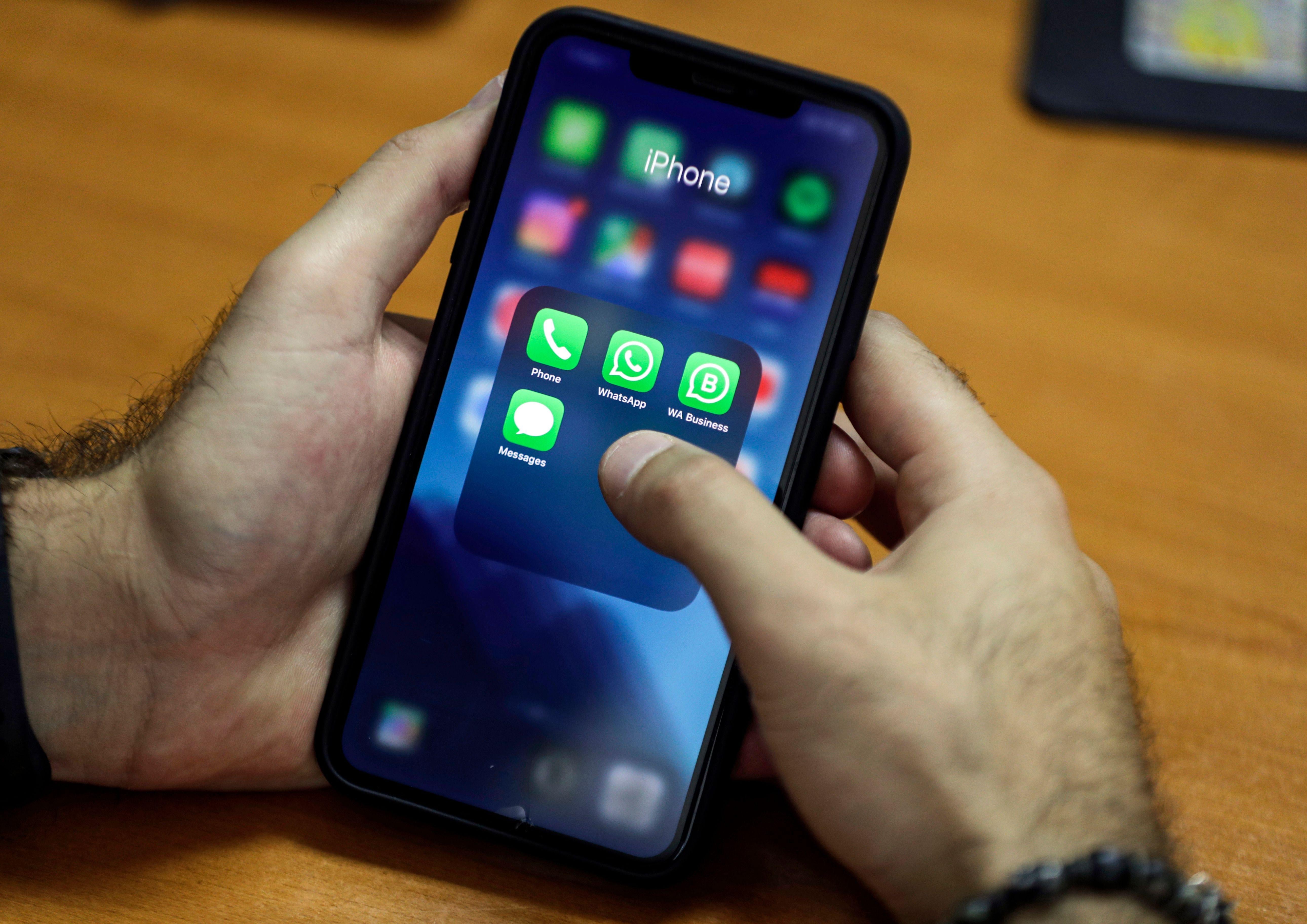 A man using an iPhone