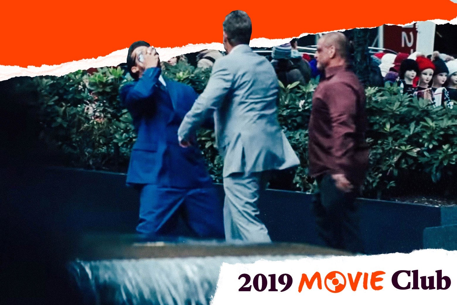 Three characters who are not facing the camera argue in this still from Uncut Gems.