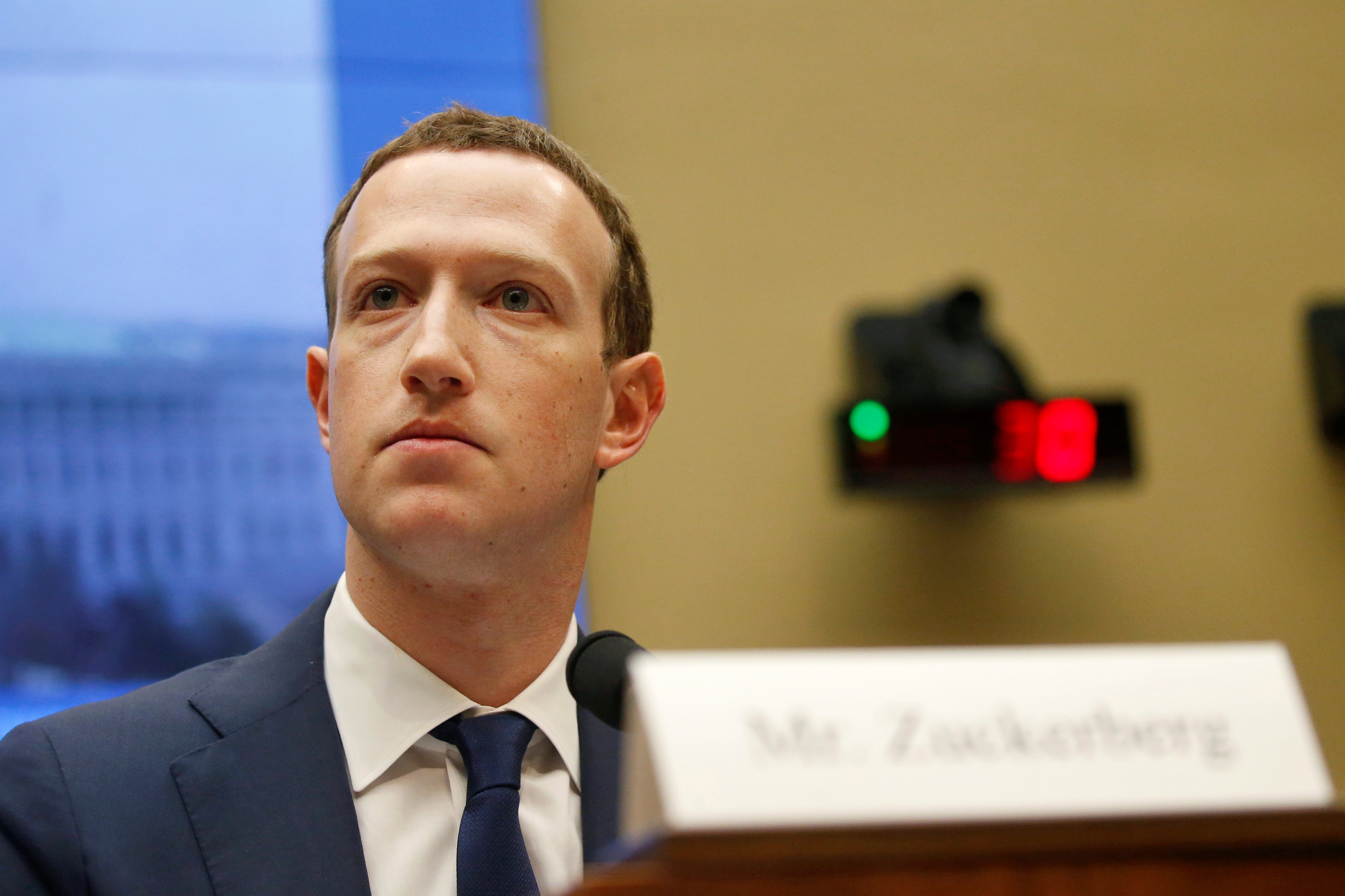 Mark Zuckerberg appears behind a nameplate as he testifies in Congress.
