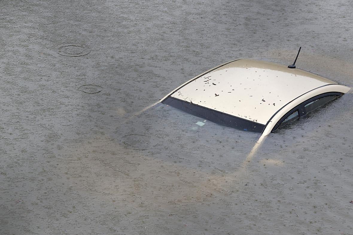 A car submerged in floodwater.