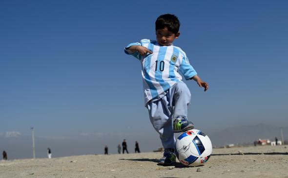 Five-year-old Murtaza Ahmadi pictured wearing homemade 'Messi 10