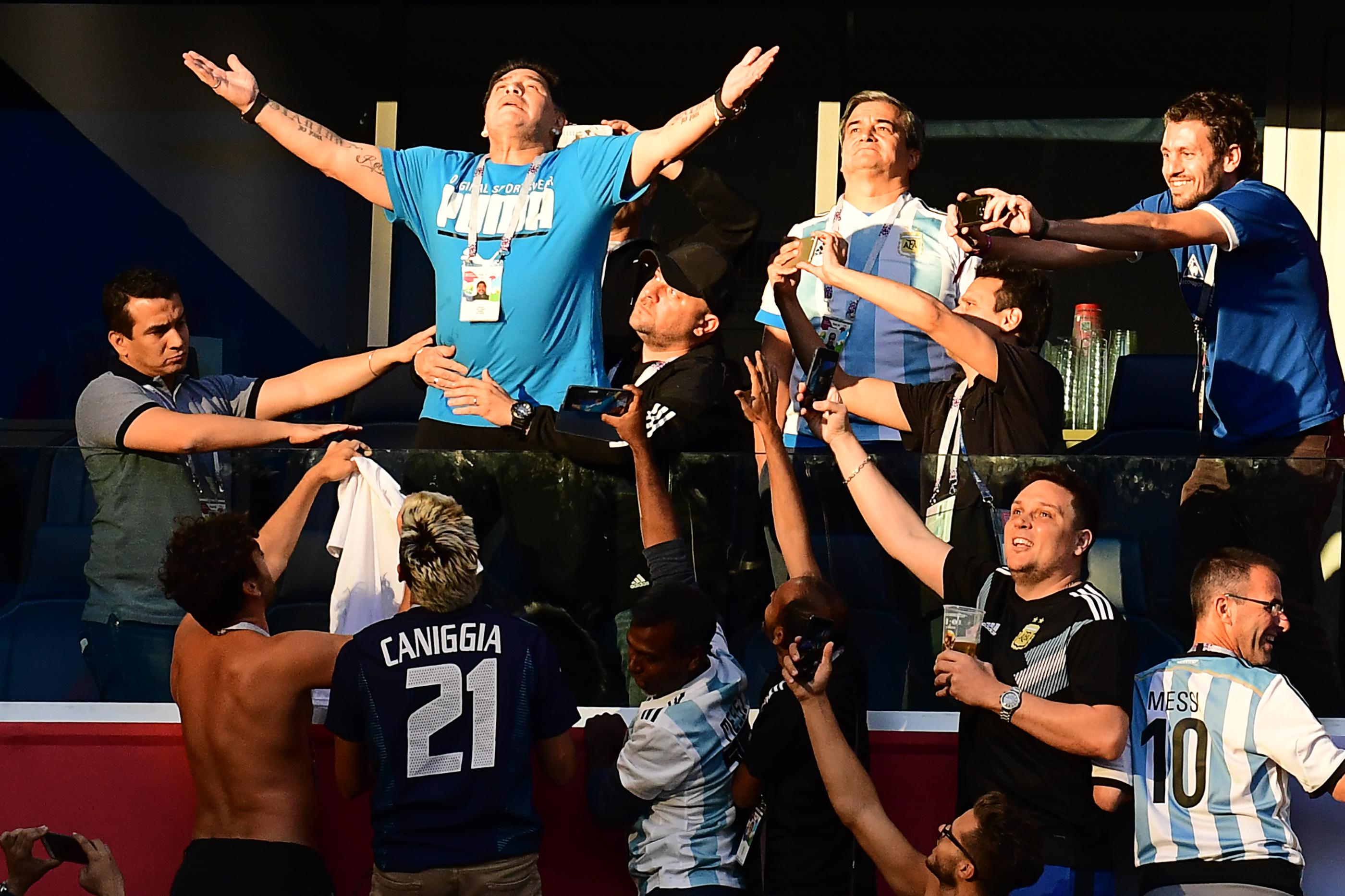 Retired Argentina forward Diego Maradona (2nd-L) poses ahead of the Russia 2018 World Cup Group D football match between Nigeria and Argentina at the Saint Petersburg Stadium in Saint Petersburg on June 26, 2018. - Maradona won the World Cup with Argentina in 1986. (Photo by Giuseppe CACACE / AFP) / RESTRICTED TO EDITORIAL USE - NO MOBILE PUSH ALERTS/DOWNLOADS (Photo credit should read GIUSEPPE CACACE/AFP/Getty Images)