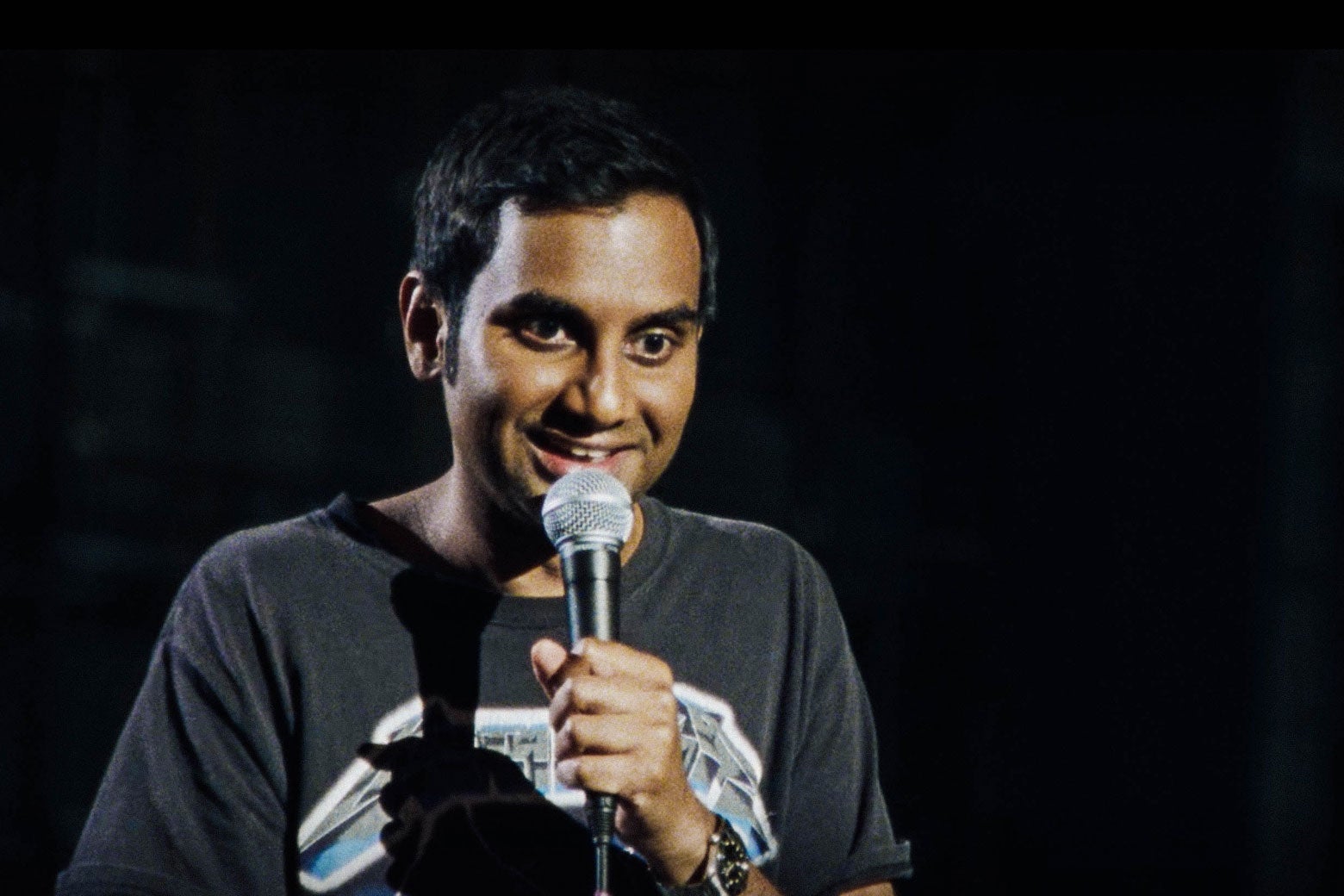 Aziz Ansari in his Right Now stand-up clothes: a Metallica T-shirt and jeans.