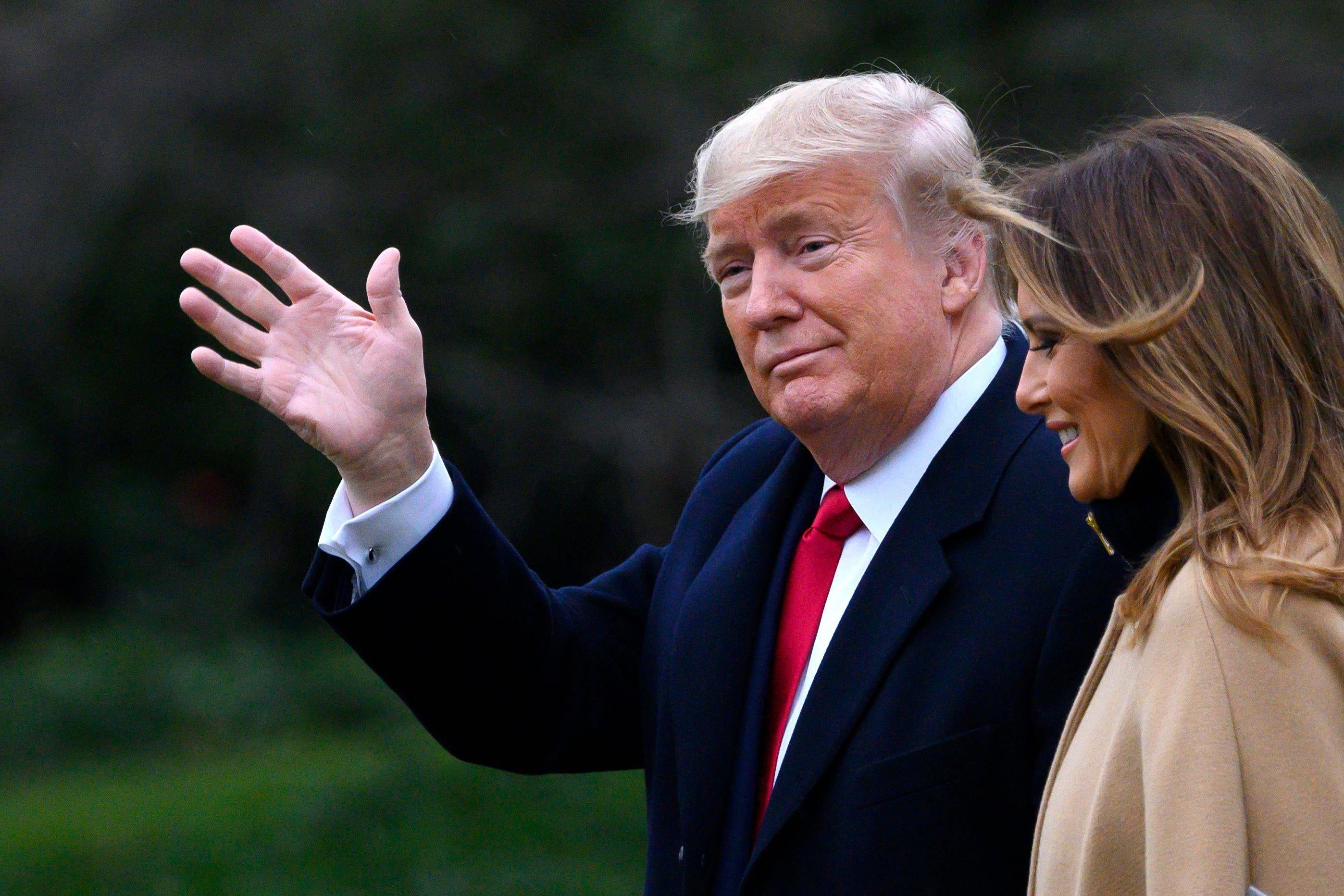 President Donald Trump waves as he and First Lady Melania Trump walk to Marine One before departing from the South Lawn of the White House in Washington, D.C. on January 31, 2020. 