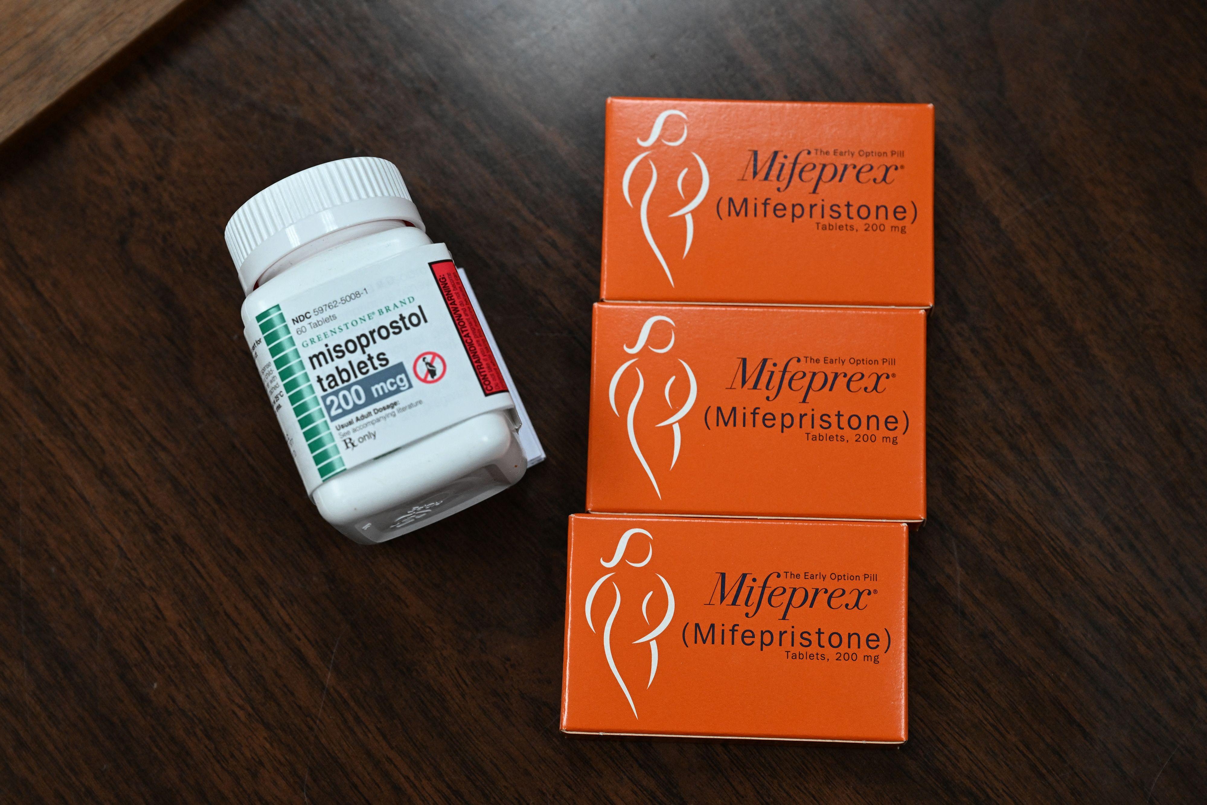 The containers for medication abortion on a table.