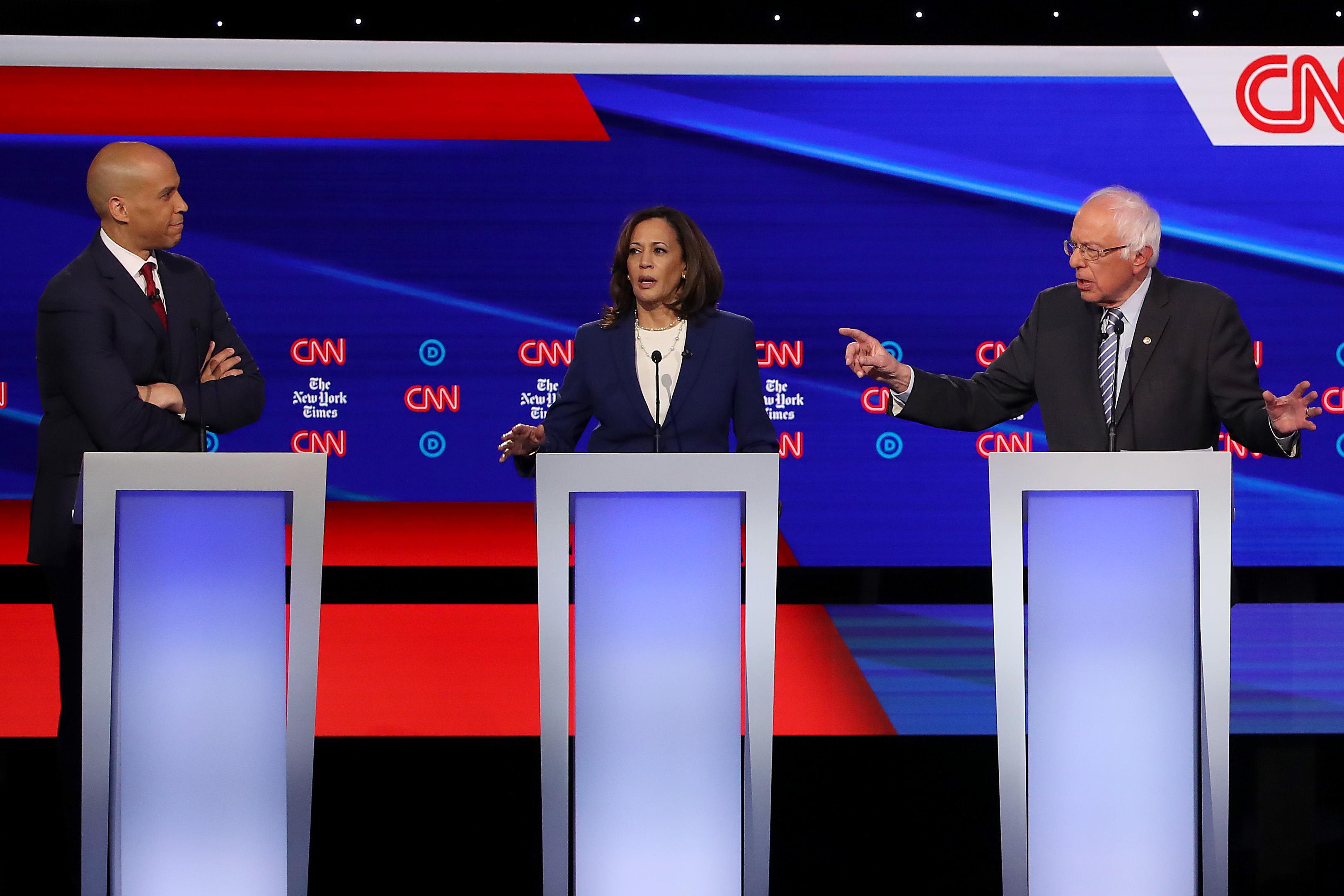Cory Booker, Kamala Harris, and Bernie Sanders debate.