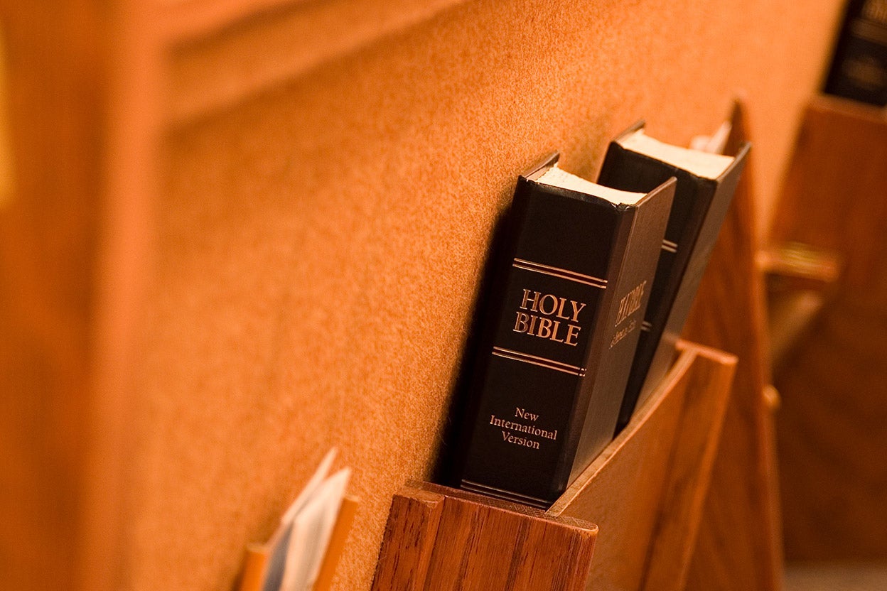 A bible seen at a pew.