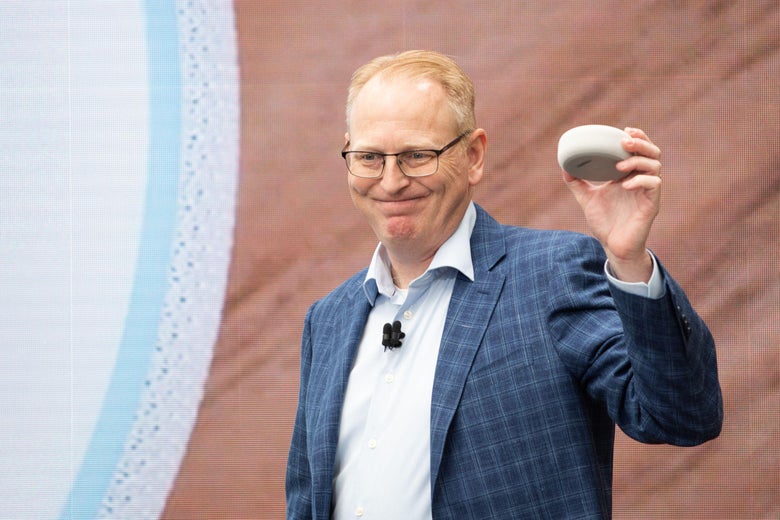 Dave Limp, senior vice president of Amazon devices, holds up an Echo Dot.