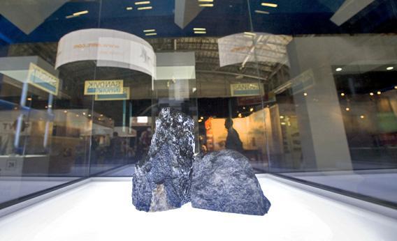 Two pieces of platinum ore are displayed at the Investing in Africa Mining Indaba in February 2012 in Cape Town. 
