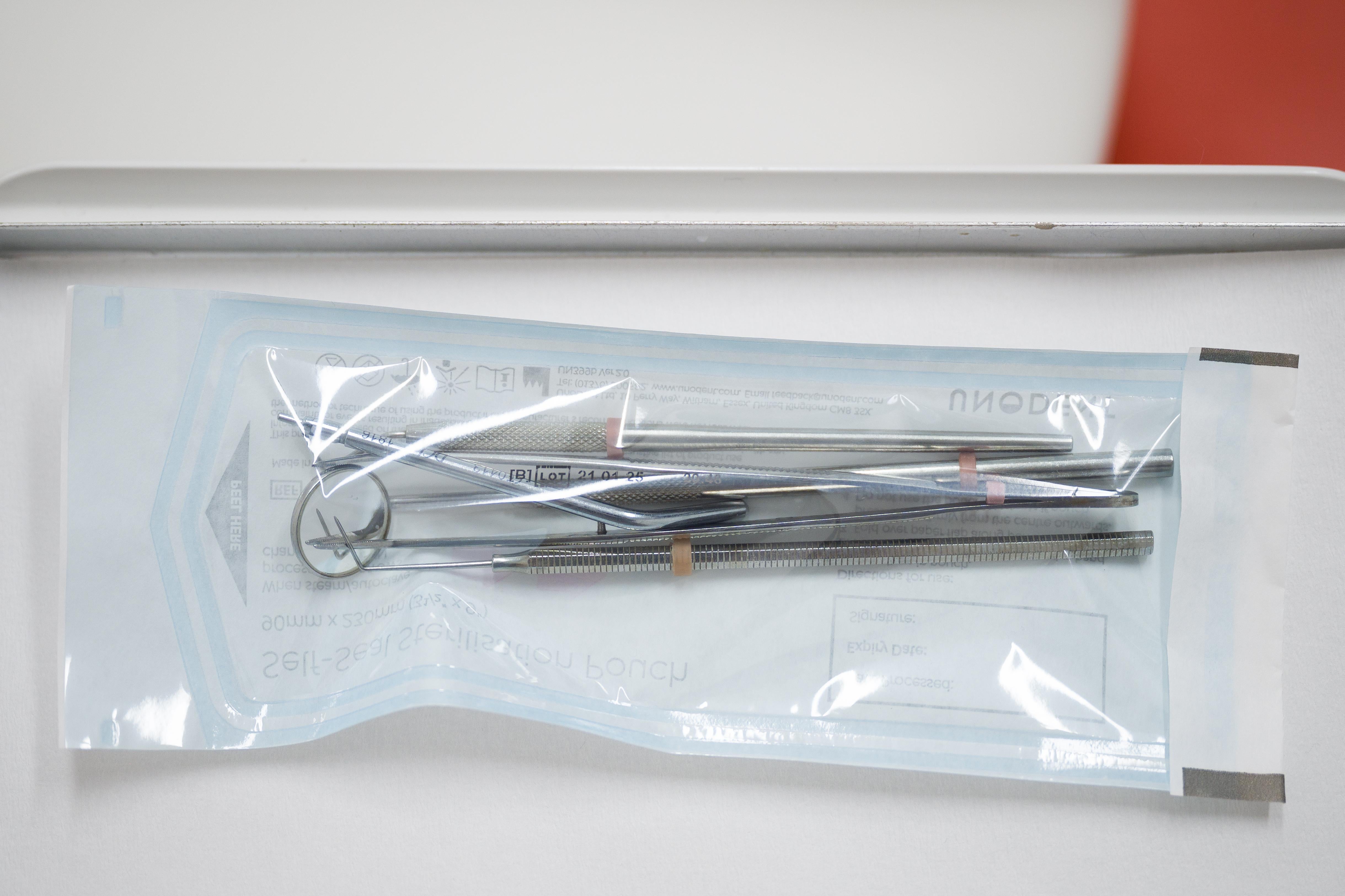 Sterilised dental tools are seen in a surgery room at East Village dental practice on May 28, 2020 in London, England. With dental staff facing a greater chance of infection due to airborne COVID-19 particles created during certain procedures, many have been forced to close throughout the lockdown with only emergency procedures still taking place at selected practices. Full PPE must be worn whenever a procedure is expected to involve the creation of airborne contaminants, with each surgery room then left for an hour for them to settle, before a disinfection process takes place. During the average day, around twelve patients will actually be seen by the staff, while over thirty more are assisted over the telephone. (Photo by Leon Neal/Getty Images)