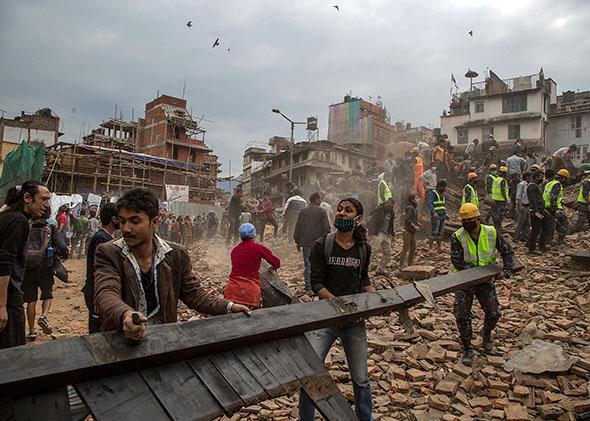 Emergency rescue workers clear debris in Basantapur Durbar Square while searching for survivors on April 25, 2015 in Kathmandu, Nepal. 