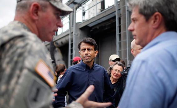 Louisiana Governor Bobby Jindal and Sen. David Vitter (R-LA) receive an update during Hurricane Isaac.