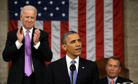 Vice President Joe Biden, left, applauds as President Obama gives his State of the Union address during a joint session of Congress at the U.S. Capitol, Feb. 12, in Washington, D.C.