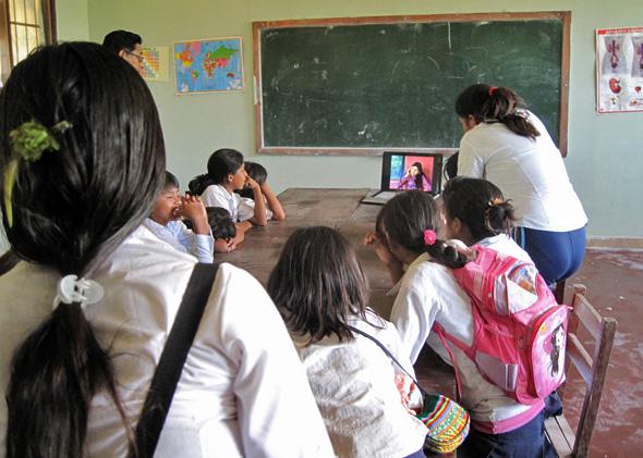 Bolivian students working with a computer in the classroom, November 25, 2010.