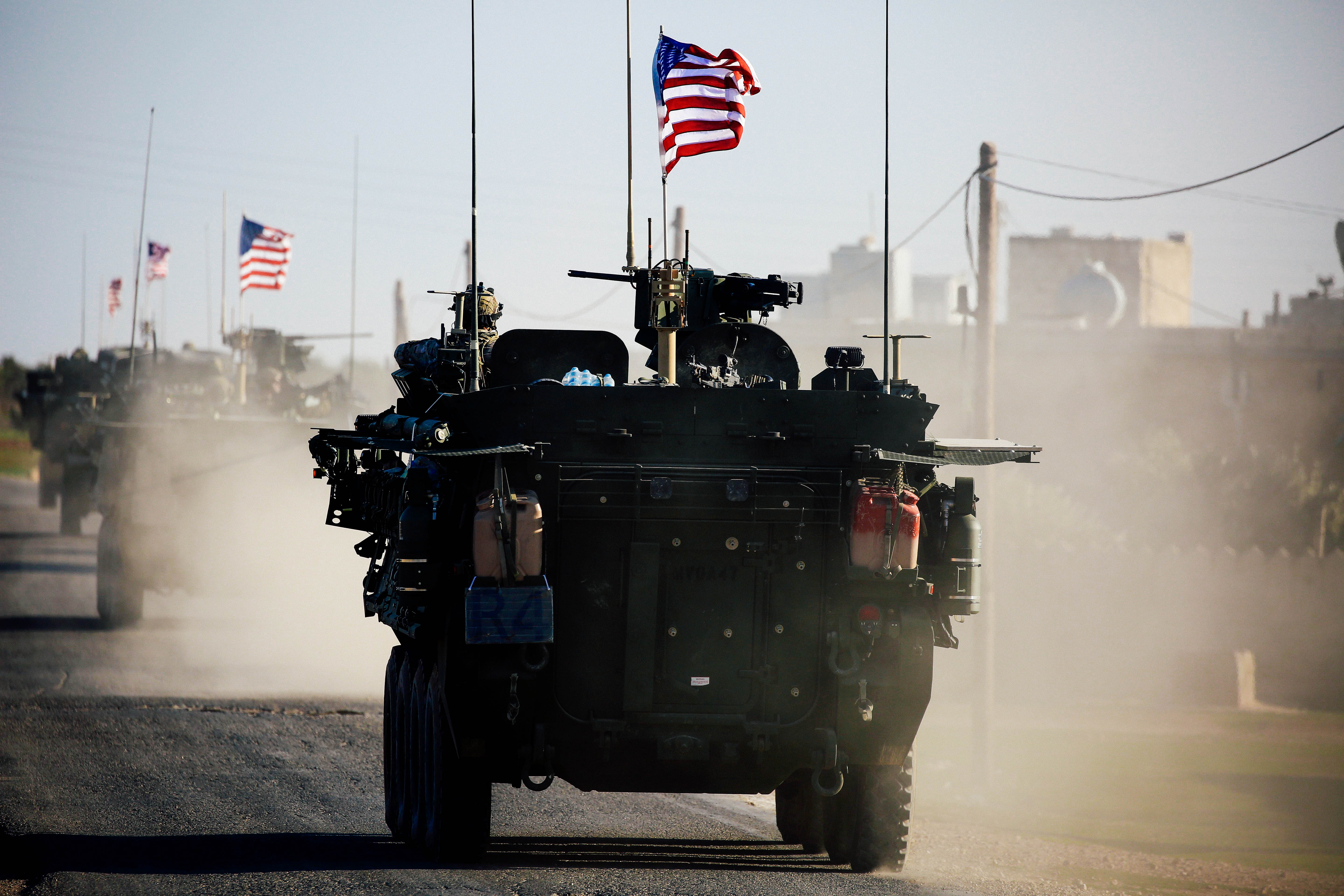  A convoy of US forces armoured vehicles drives near the village of Yalanli, on the western outskirts of the northern Syrian city of Manbij, on March 5, 2017. / AFP PHOTO / DELIL SOULEIMAN (Photo credit should read DELIL SOULEIMAN/AFP/Getty Images)