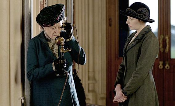 The dowager countess talks on the phone.