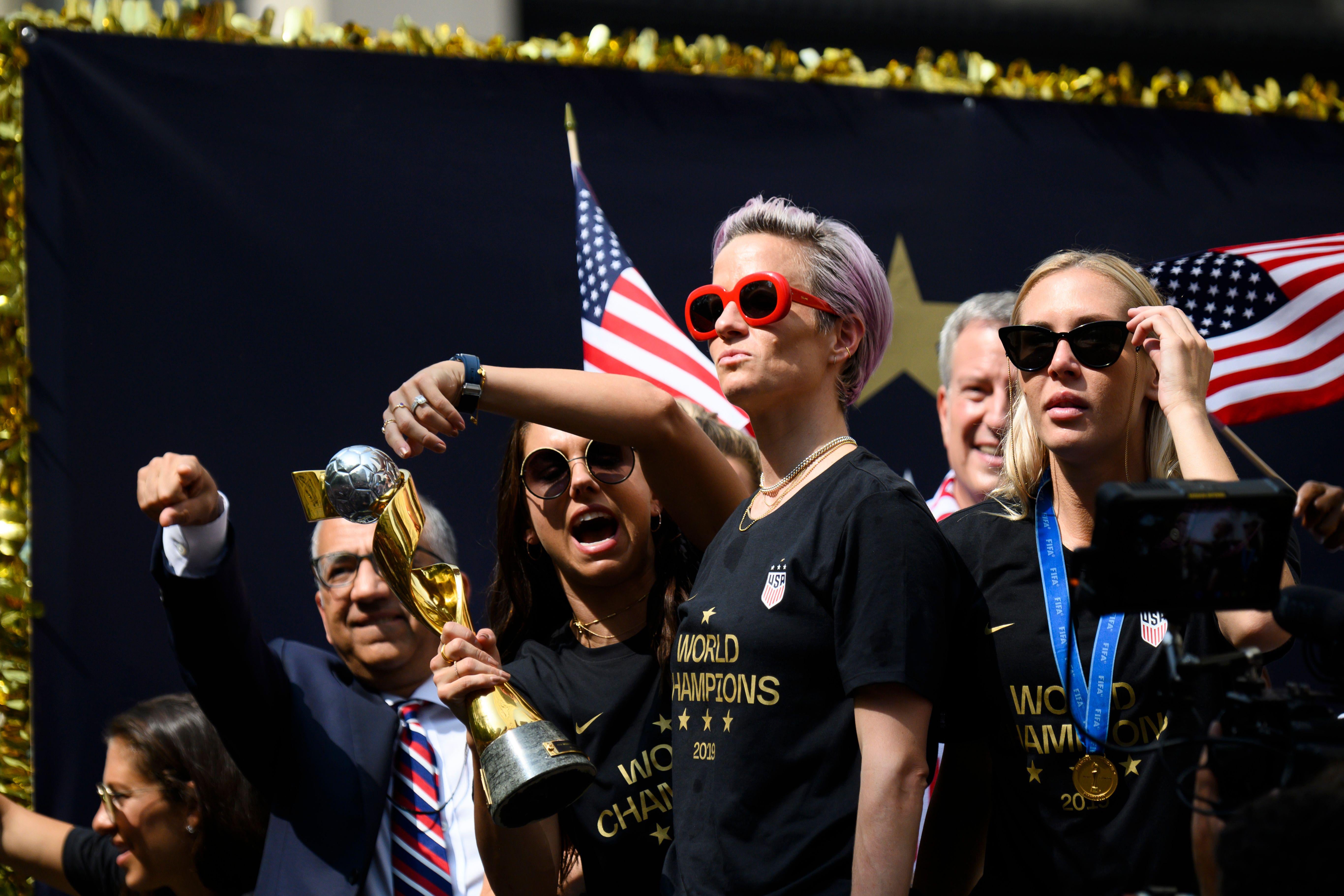 Megan Rapinoe and her teammates celebrate at the ticker-tape parade in New York.