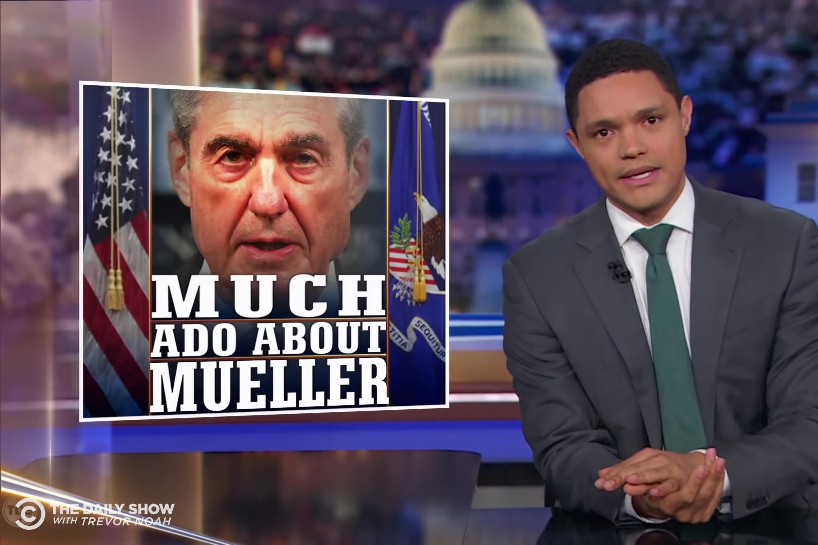 Trevor Noah sits at an anchor desk in front of a chyron reading "Much Ado About Mueller."