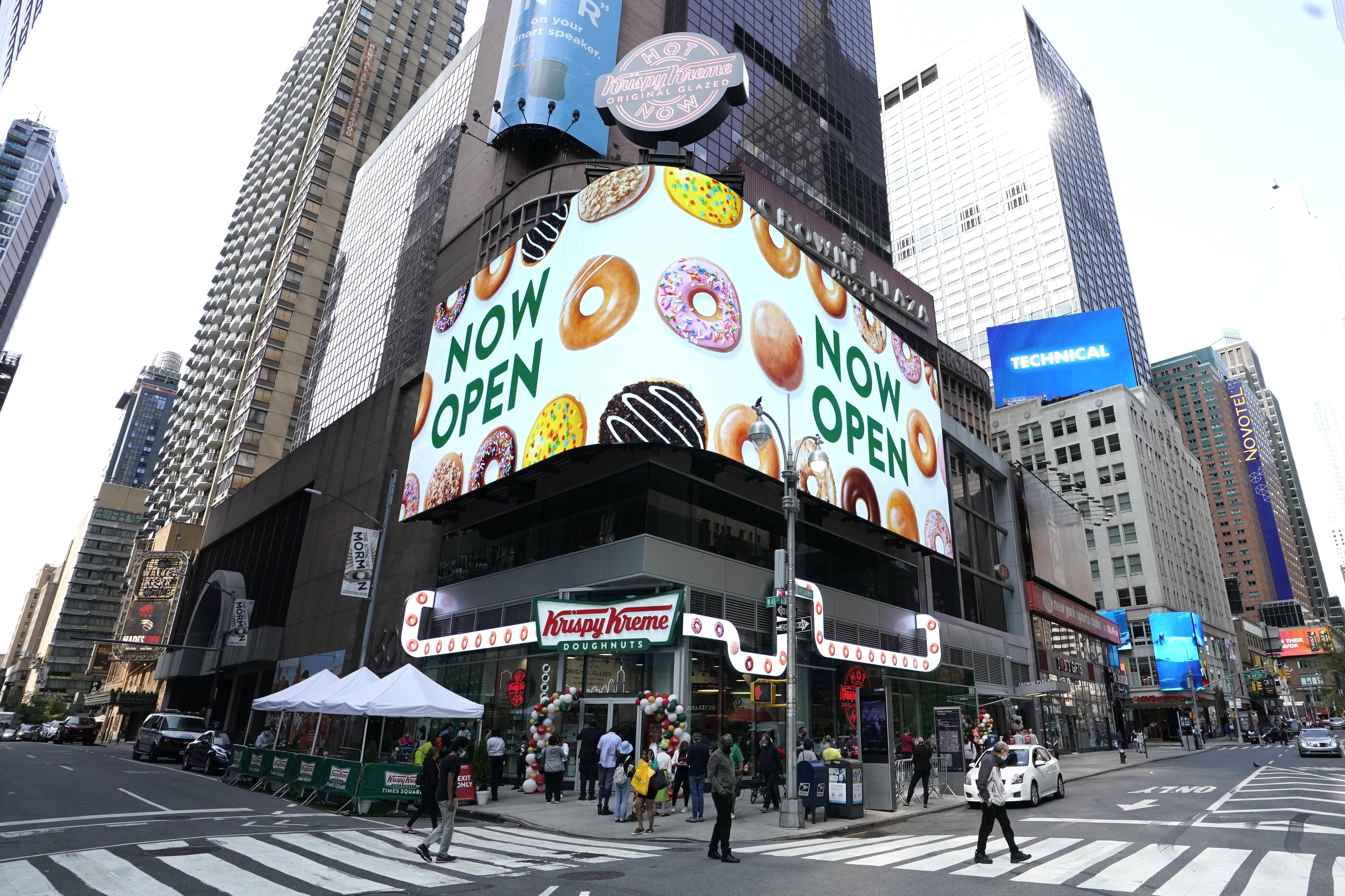 Outside view of the new Krispy Kreme flagship store amid the coronavirus pandemic in Times Square, New York, September 15, 2020. - The 4,500 square-foot donut shop includes a glaze waterfall, a 24-hour street pick-up window, and a system that can make more than 4,500 donuts an hour. (Photo by TIMOTHY A. CLARY / AFP) (Photo by TIMOTHY A. CLARY/AFP via Getty Images)