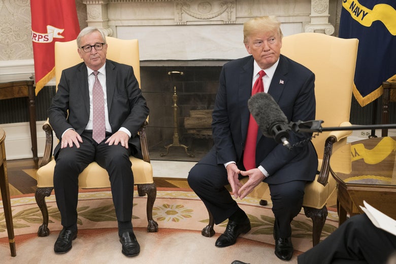 President Trump sits in the Oval Office next to President of the European Commission Jean-Claude Juncker during a press availability.