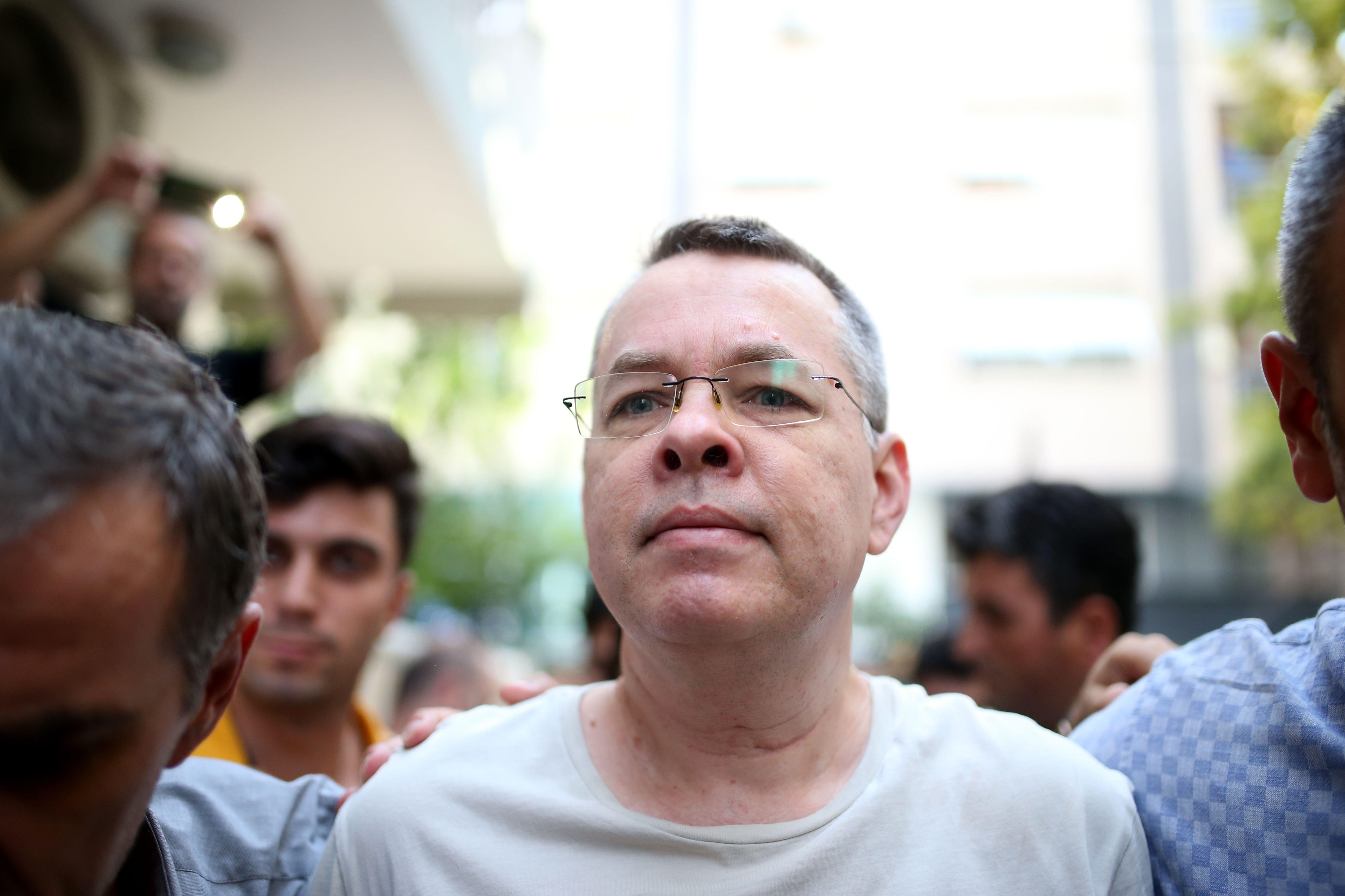 Andrew Craig Brunson escorted by Turkish plainclothes police officers