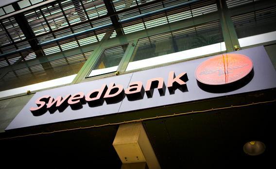 A sign hangs from a branch of Swedbank AB in Stockholm, Sweden, in 2010. 