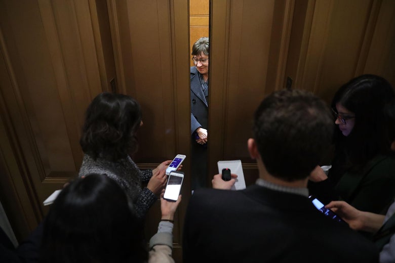 Elevator doors close as Sen. Susan Collins finishes talking to reporters on Capitol Hill.