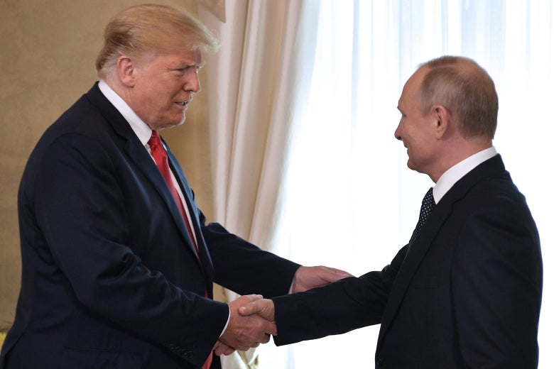 U.S. President Donald Trump shakes hands with Russia’s President Vladimir Putin on July 16.