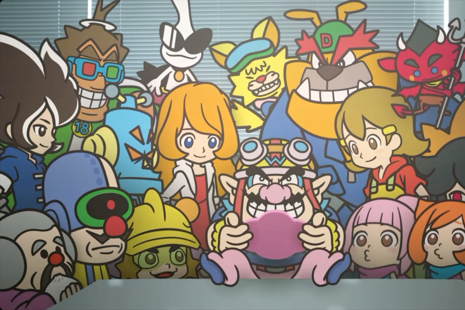 Multiple brightly colored characters with large eyes look at a man with a large pointy black mustache in the center. He holds a pink handheld game console and looks down at the screen, his purple shoes and pink pants propped upon a table in front of the group.