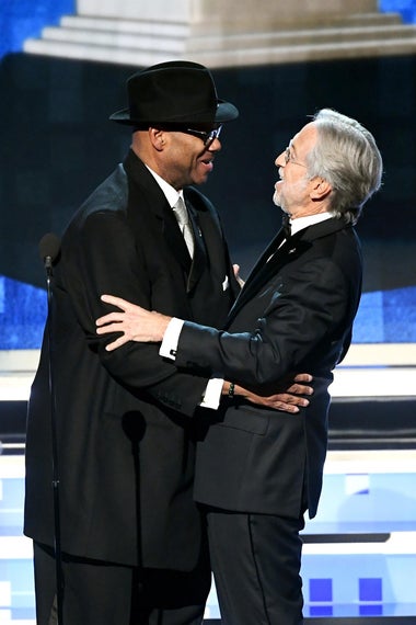 Jimmy Jam (L) and President and CEO of The Recording Academy Neil Portnow speak onstage during the 61st Annual GRAMMY Awards at Staples Center on February 10, 2019 in Los Angeles, California. (Photo by Kevin Winter/Getty Images for The Recording Academy)