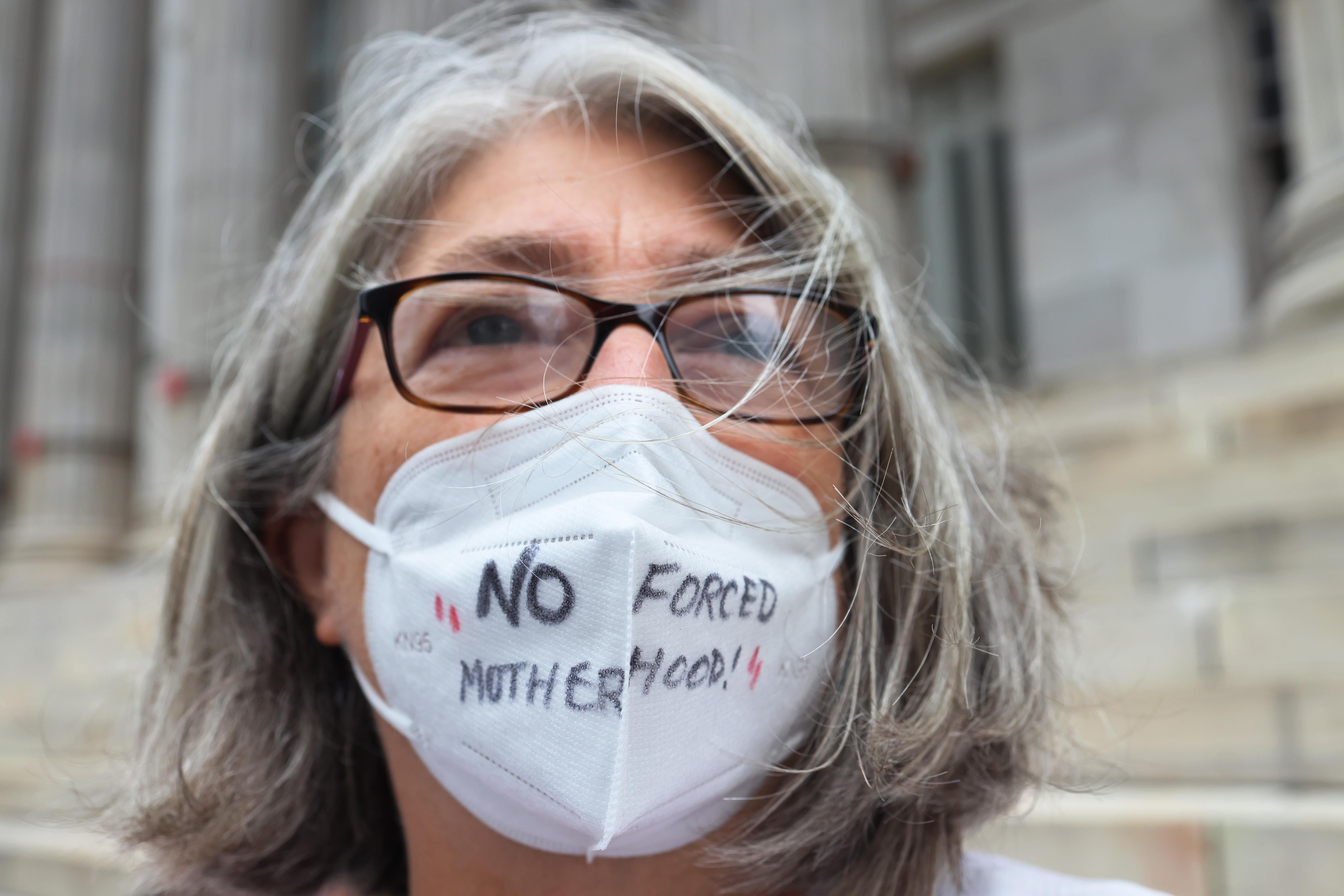Debra Sweet, wears a mask inscribed with the words "No Forced Motherhood" as she joins people gathered for a reproductive rights rally at Brooklyn Borough Hall on September 1, 2021 in Downtown Brooklyn in New York City. 