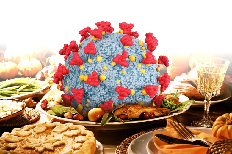 A coronavirus molecule at the center of a Thanksgiving dinner table.