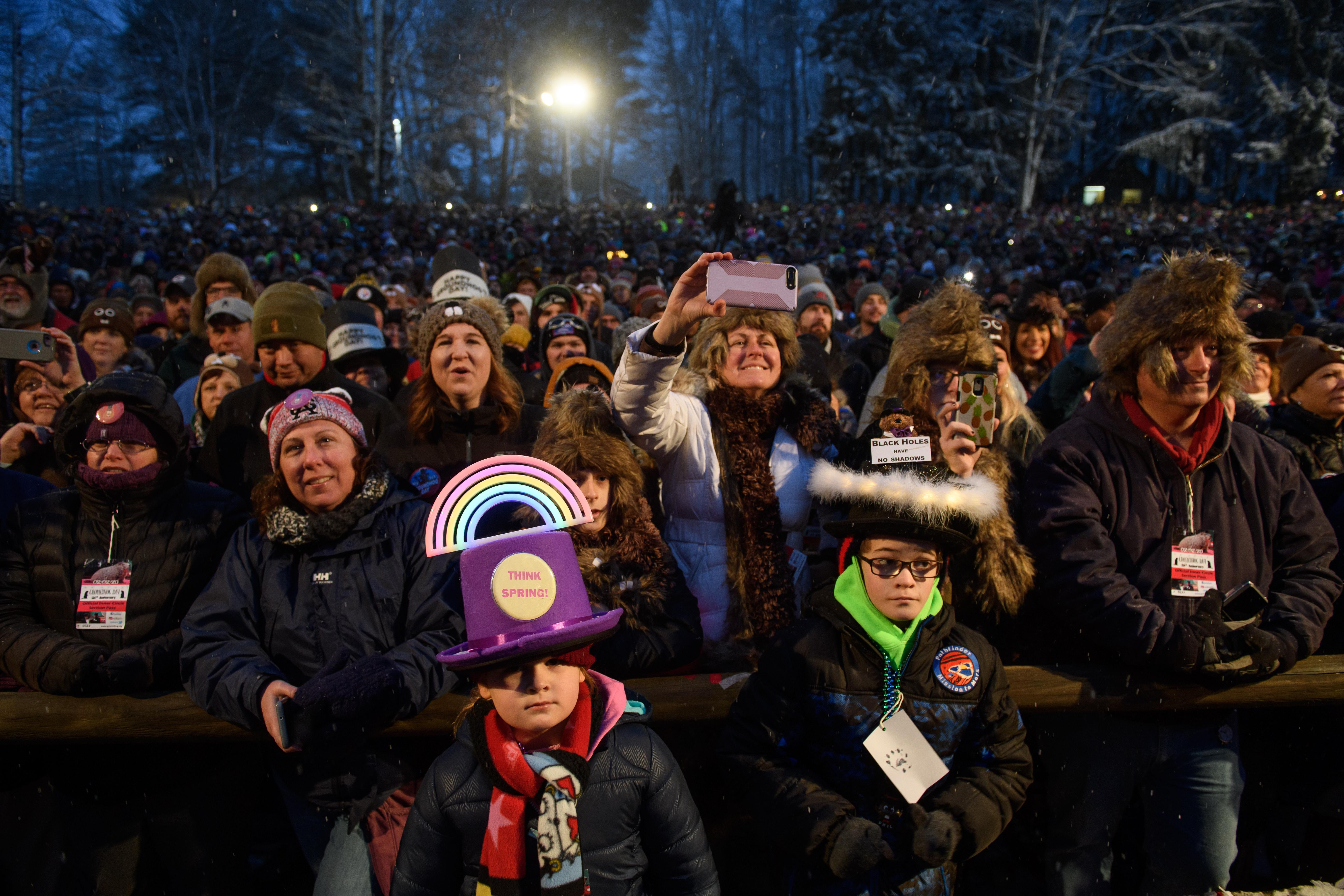 Lauren Edwards, 7, and her brother, Matthew, 11, from Downington, Pennsylvania await the arrival of Punxsutawney Phil during the 134th annual Groundhog Day festivities on February 2, 2020 in Punxsutawney, Pennsylvania.