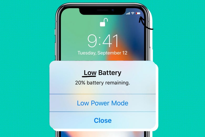 Photo illustration: An iPhone X with a superimposed image of the "low battery" notification.