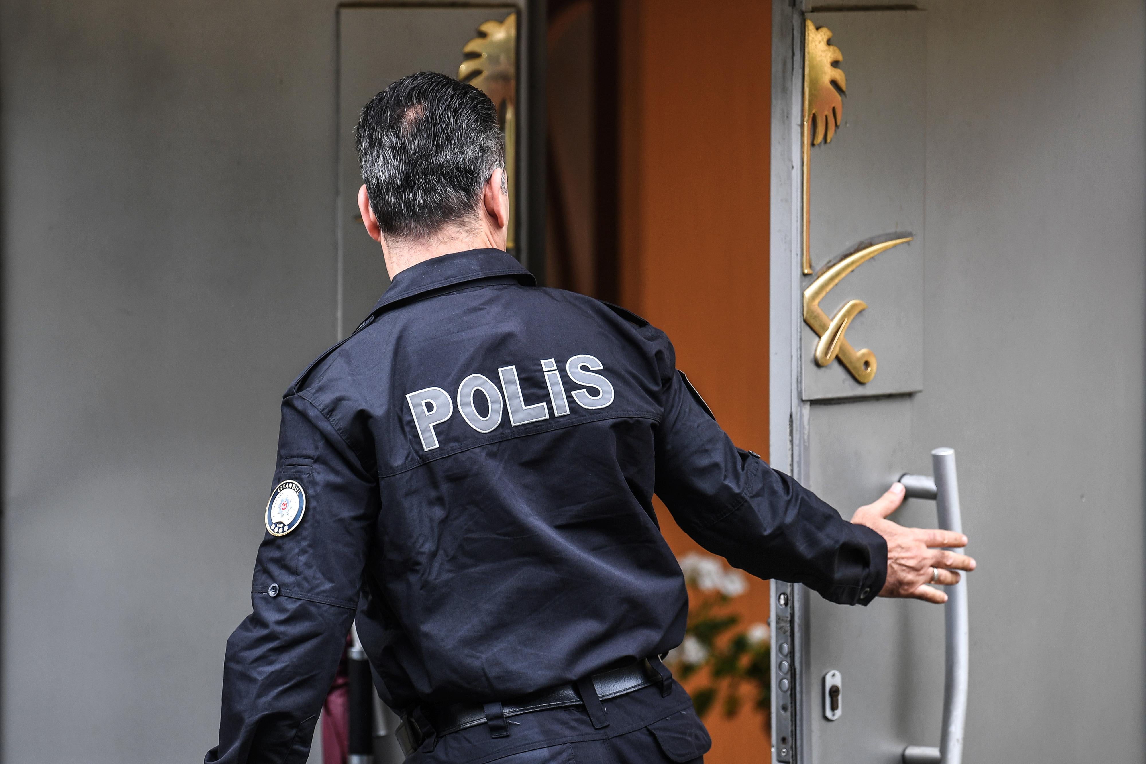 A Turkish policeman stands in front of the door at the Saudi consulate in Istanbul.