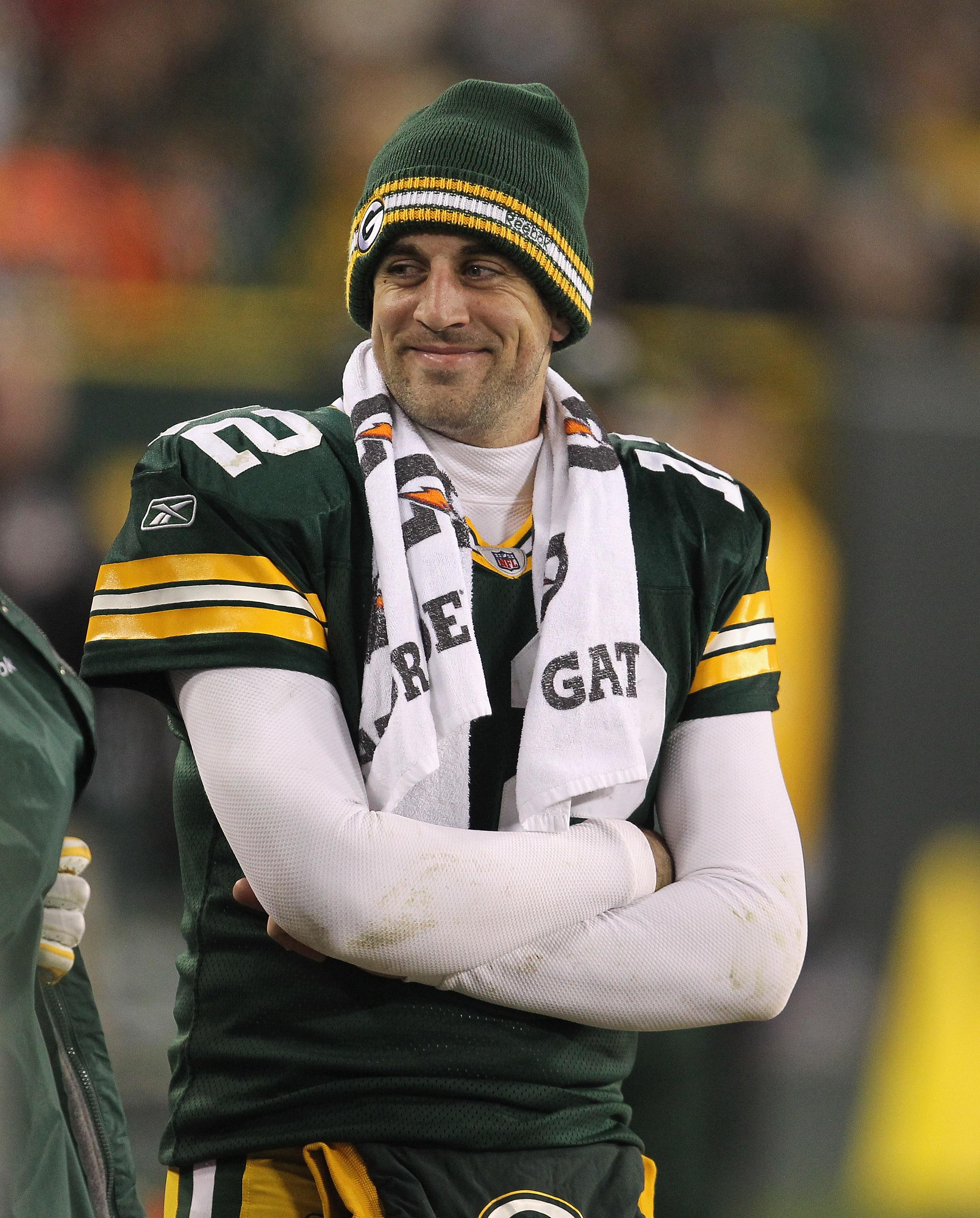 Aaron Rodgers smiles on the sidelines during Green Bay's 45-7 win over Minnesota