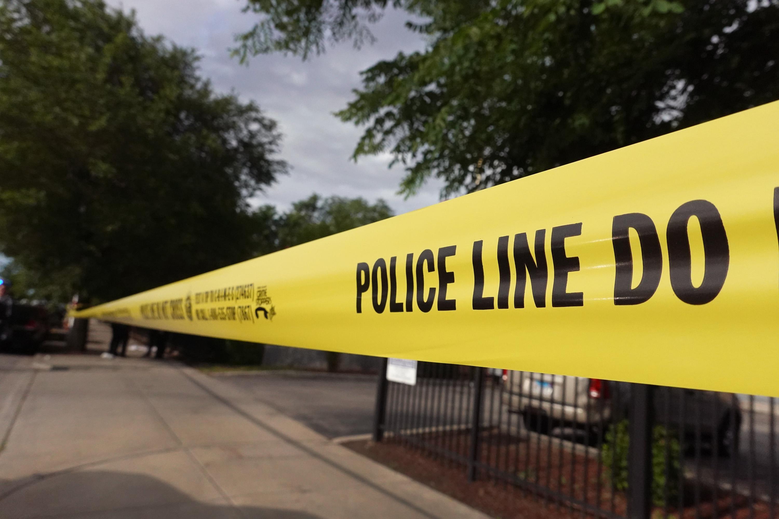 Police tape surrounds a crime scene where three people were shot at the Wentworth Gardens housing complex in the Bridgeport neighborhood on June 23, 2021 in Chicago, Illinois. 