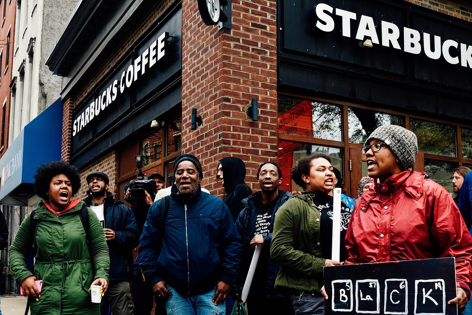 Protesters gather on Monday at the Starbucks location in Philadelphia where two black men were arrested.