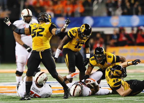Mike Sams, No. 52, reacts to a defensive play in the 2014 Cotton Bowl. 