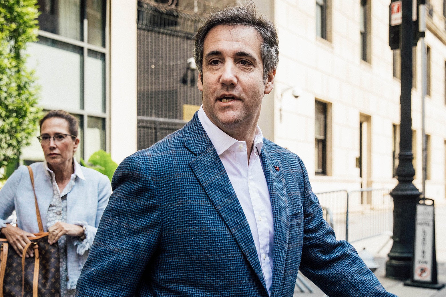 Michael Cohen exits a hotel in New York.